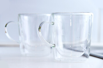 Two double-walled glass empty and transparent clear cup