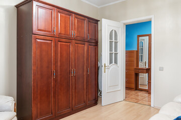 large brown closet in the living room