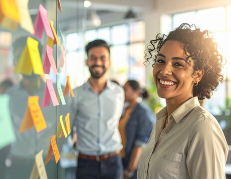 Team Brainstorming with Sticky Notes in Bright Office