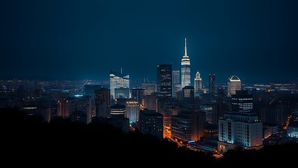 A city skyline illuminated at night with long exposure and deep blue tones.