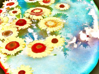 水面に浮かぶひまわりと夏の光