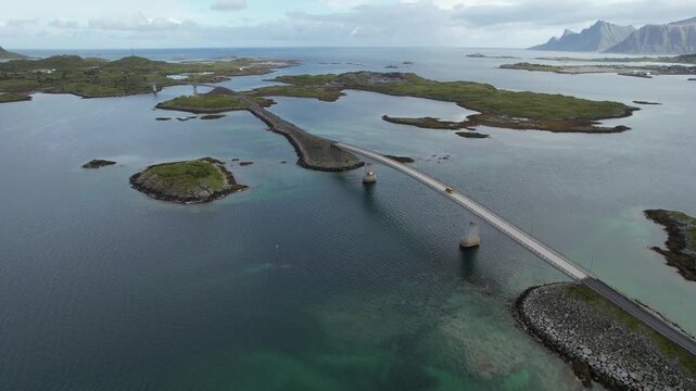 Drone aerial 4k footage of fredvang bridges stretches over tranquil waters, linking several   fjiords. Nordland transportation infrastructure, lofoten islands, Norway