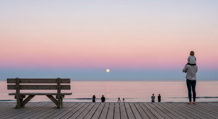 Obraz premium A father with a child on his shoulders stands on a boardwalk at sunset, looking out at the ocean horizon