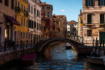 Venice – City of Canals and Bridges. Traditional Venetian Buildings with Boats and Bridges. Romantic Venice, Italy – The Floating City