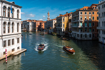 Venice – City of Canals and Bridges. Traditional Venetian Buildings with Boats and Bridges. Romantic Venice, Italy – The Floating City