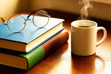 Stack of books with reading glasses and coffee: Publishing, Bookstores, Lifestyle, Education