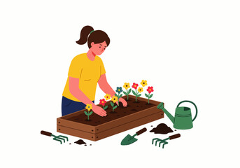 Woman planting colorful flowers in a raised garden bed, with gardening tools and a watering can nearby.