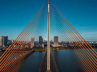 Symmetric modern cable-stayed bridge over Han River in Da Nang, Contemporary urban span connecting city skyline across Vietnamese waterway