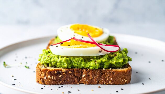 Avocado toast with egg, radish, and sesame. - Powered by Adobe