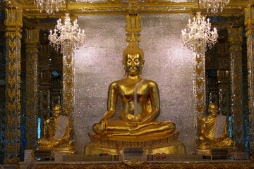 Golden Buddha in Glass Ubosot at Wat phuttha prommayan, Chachoengsao Province Thailand