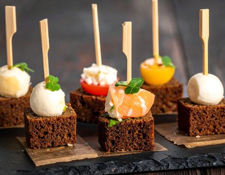 Appetizers with various ingredients on rye bread cubes