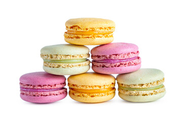 Stack of colorful French macarons isolated on white background.