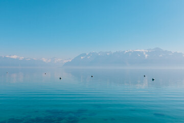 Lake Geneva with mountains and calm water
