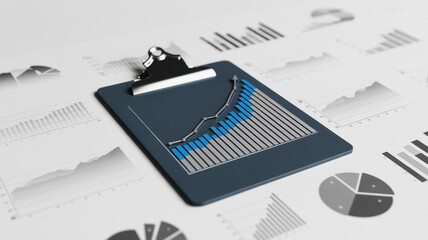 Close up of a clipboard with a bar graph on top of other graphs and charts, representing data analysis and business performance