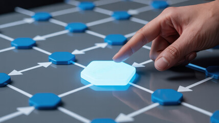 Hand pointing at glowing hexagon in network, representing connection, innovation, technology, and digital transformation in business