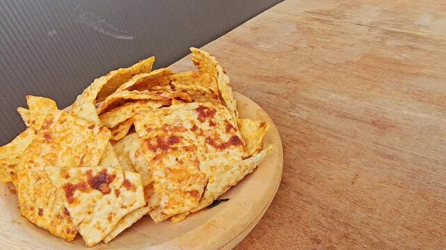apple pie on a wooden board,Kerupuk or Krupuk Opak balado or Spicy Opak cracker is Indonesian traditional cracker made from cassava dough,crackers coated with chili sauce
