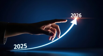 Hand pointing to the future with an arrow showing growth from 2025 to 2026