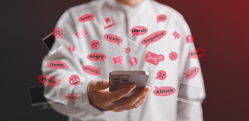 A person using a smartphone surrounded by negative social media comments like hate, bully, and toxic words, representing online harassment, cyberbullying, and digital abuse on the internet.