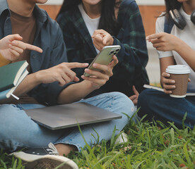 Happy students walking together on university campus, chatting and laughing outdoors after classes