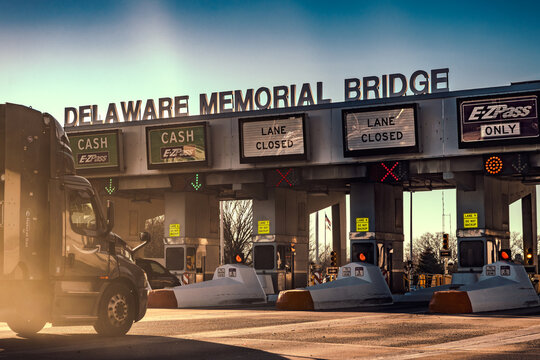 Large truck driving to bridge toll plaza