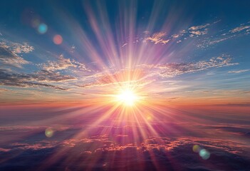Fototapeta premium Vivid sunrise or sunset scene. The sun's brilliant rays burst through the clouds, illuminating the sky