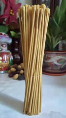 Fototapeta premium Bundle of natural wood incense sticks, aromatic fragrance for meditation