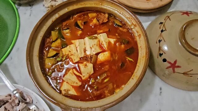 indian curry paste,Kimchi jjigae or Kimchi soup in ceramic bowl
Korean kimchi stew.Korean traditional food,Sundubu jjigae