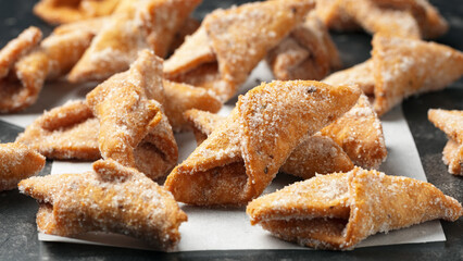 Angel Wings, Faworki, cakes. sweet pastry deep fried and sprinkled with powdered sugar.