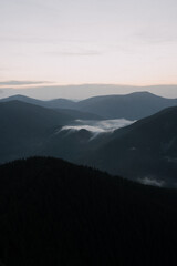Beautiful mountain landscape, light over peaks and valleys, natural scenery, calm atmosphere and wild nature