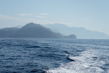 Capri, Italy - 04.29.2025: The waters of the Tyrrhenian Sea and the outlines of the islands...