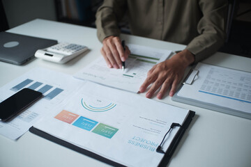 Businessman reading report in office desk analyse data for plan project