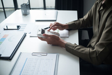 Businessman reading report in office desk analyse data for plan project