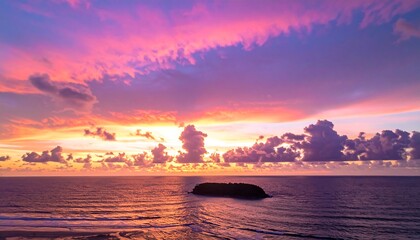 Vibrant sunset over the ocean with colorful clouds and reflections.