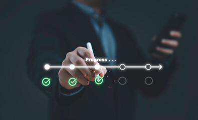 Businessman hand drawing progress timeline with checklist icons symbolizing project management...