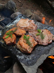 Juicy steak with asparagus on fire grill