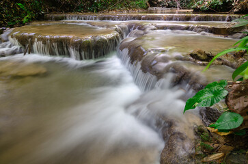 Pu Kaeng Waterfall, the most beautiful limestone waterfall in Chiang Rai Province, Thailand. A peaceful natural atmosphere in the countryside of Northern Thailand.