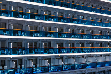Beautiful balcony views on a cruise ship showcasing outdoor seating and vibrant blue