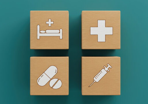 Healthcare icons on cardboard blocks representing medical care and treatment options - Powered by Adobe