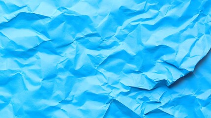 Obraz premium Abstract light blue crumpled paper texture background for graphic design