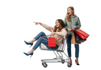 Joyful friends laughing and pointing while riding in shopping cart with bags isolated on transparent background