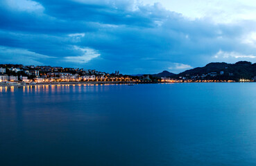 Blue hour, dusk, on La Concha beach in San Sebastian, Spain