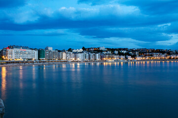 Blue hour, dusk, on La Concha beach in San Sebastian, Spain