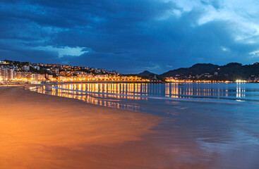 Blue hour, dusk, on La Concha beach in San Sebastian, Spain