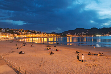 Blue hour, dusk, on La Concha beach in San Sebastian, Spain