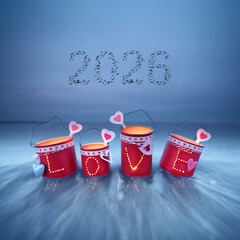 red LOVE Lanterns Crafted from Tin Cans on the beach for new year 2026 from flying birds in the sky