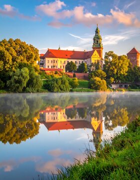 Historic castle reflected in a still, misty river at dawn