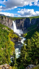 Obraz premium Dramatic Waterfall Scenery - Hafragilsfoss in Icelands Natural Beauty.