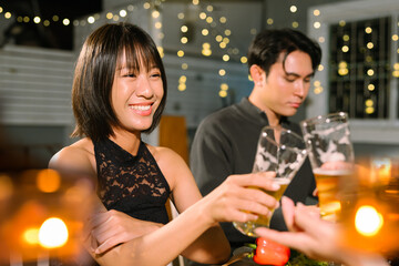 food and drink male friends are happy drinking beer and clinking glasses at a bar or pub.