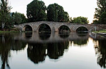 Ancient Romanesque bridge in a village in Spain