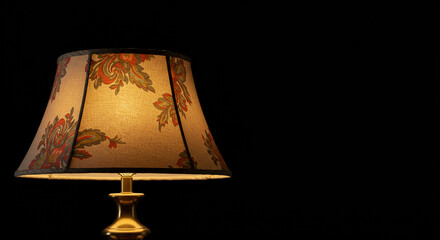 Vintage Floral Table Lamp with Warm Light on Black Background